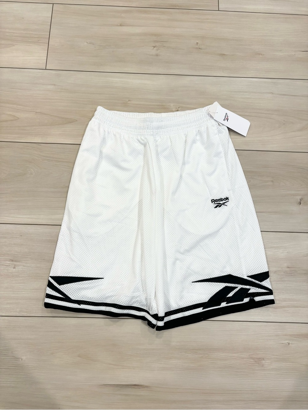 Vintage Deadstock Reebok Men’s White Mesh Basketball Shorts with Graphic Hem
